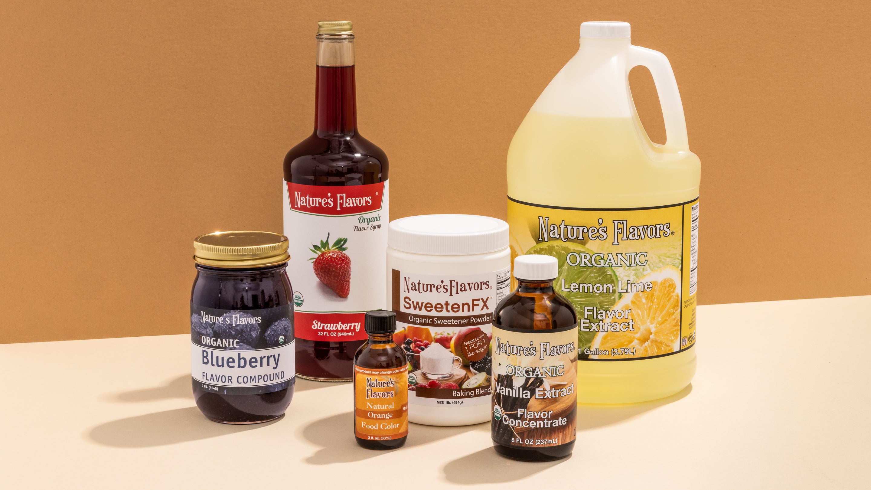An assortment of products featuring vibrant natural flavorings in bottles and syrup jars, beautifully showcased for customers to see.