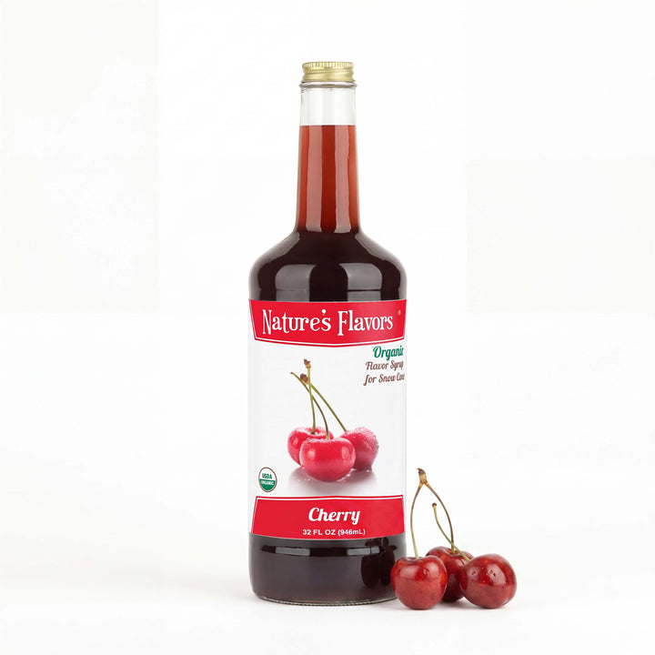 Bottle labeled, "Organic Flavor Syrup for Snow Cone" with cherries next to it. 
