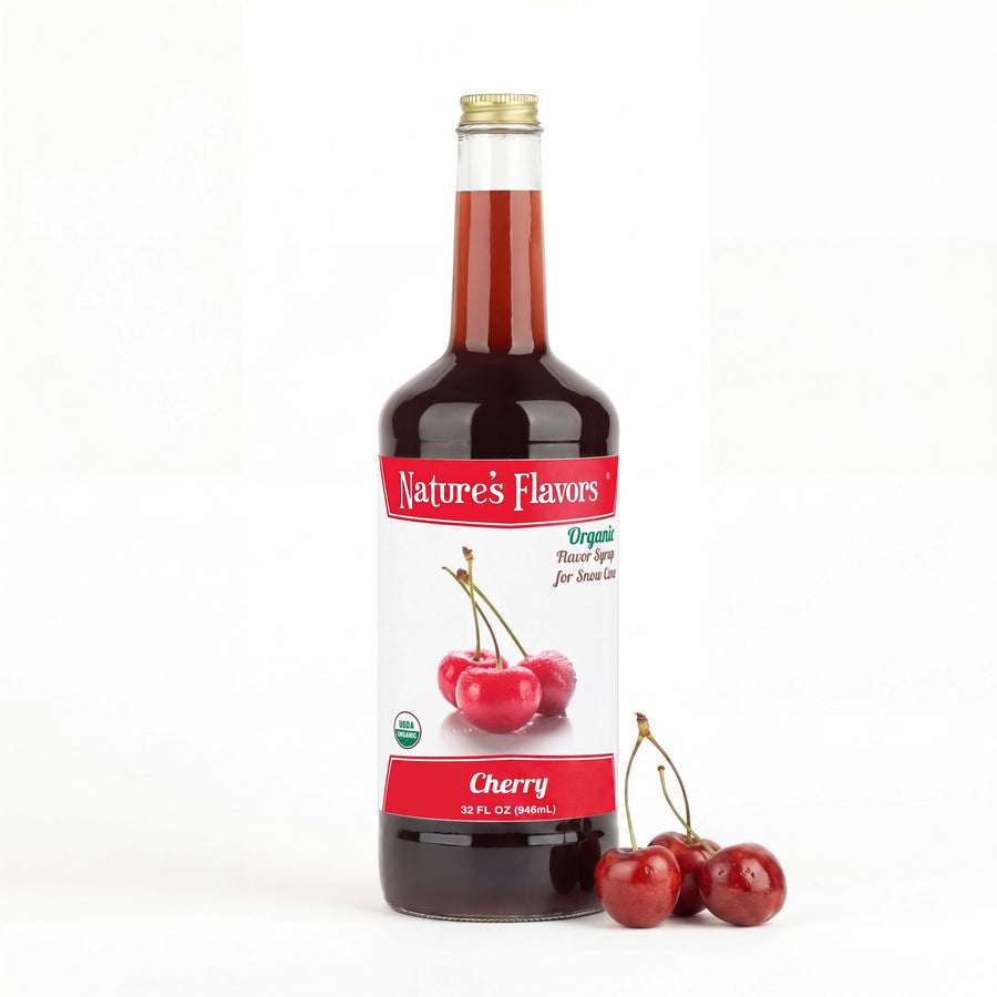 Bottle labeled, "Organic Flavor Syrup for Snow Cone" with cherries next to it. 