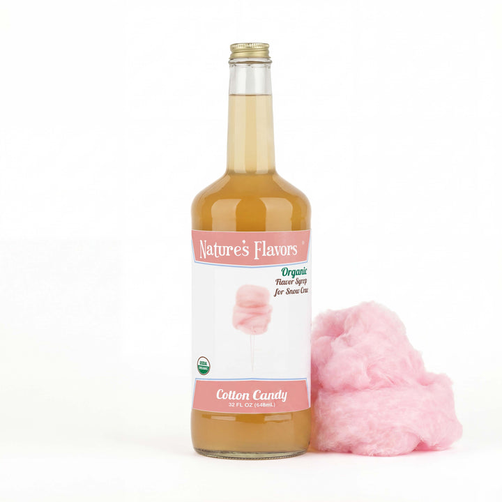 Bottle labeled, "Organic Flavor Syrup for Snow Cone" with cotton candy right next to it. 
