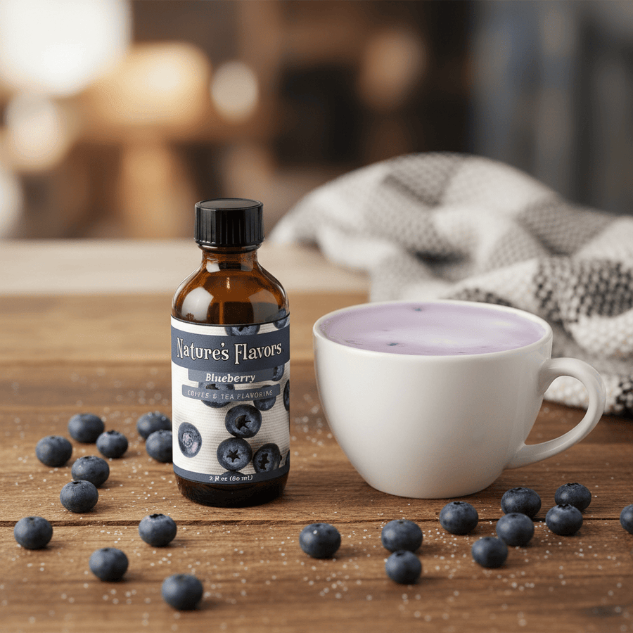Bottle of Nature's Flavors Blueberry flavoring with a cup of coffee and blueberries on a wooden surface.