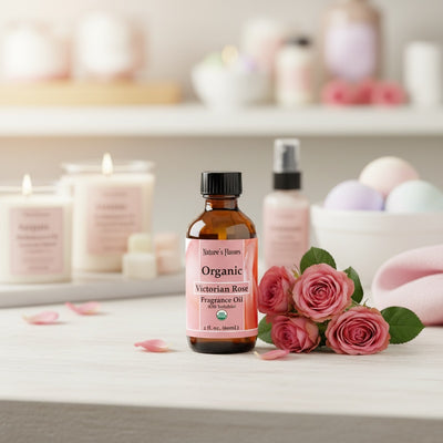 Organic Victorian Rose fragrance oil bottle with pink roses on a white surface