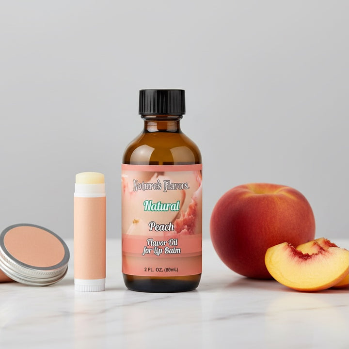Bottle of Nature's Flavors Natural Peach Flavor Oil for Lip Balm with peach and lip balm on a light gray background