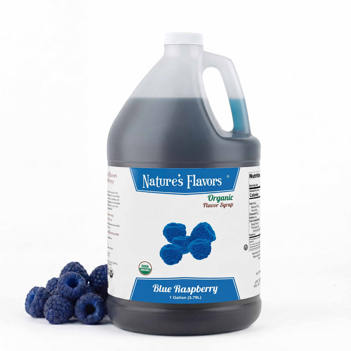 Jug labeled, "Organic Flavor Syrup Blue Raspberry" with blue raspberries next to it. 