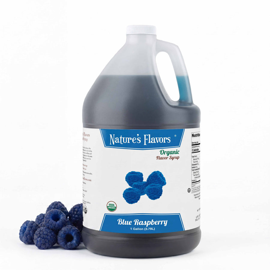 Jug labeled, "Organic Flavor Syrup Blue Raspberry" with blue raspberries next to it. 
