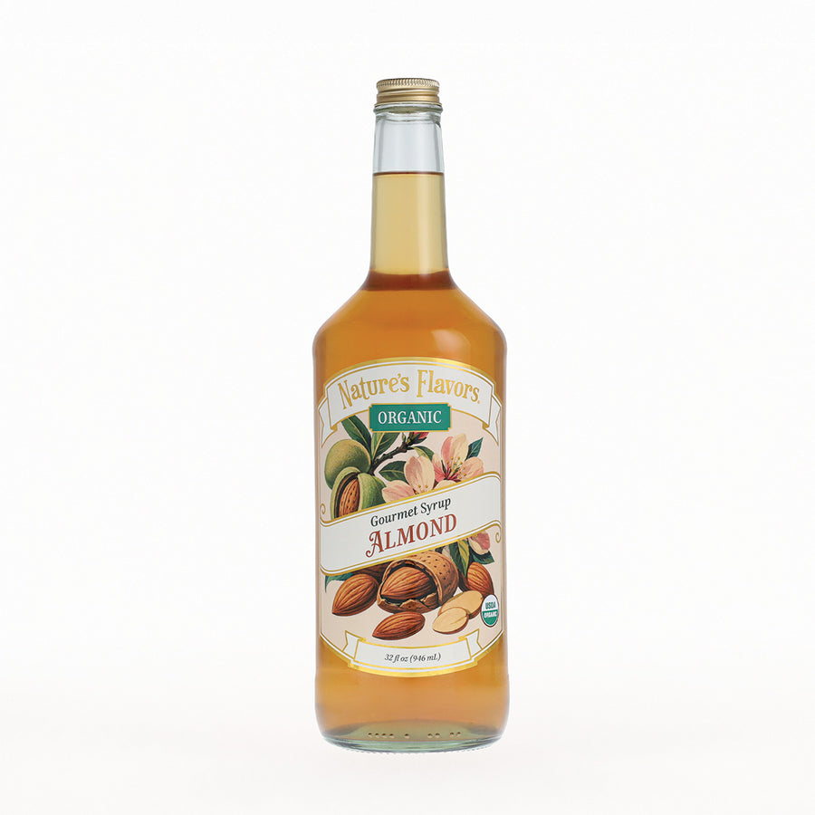 A glass bottle of Nature's Flavors Organic Gourmet Syrup Almond, filled with golden almond syrup and featuring a detailed label with almonds on a white background.