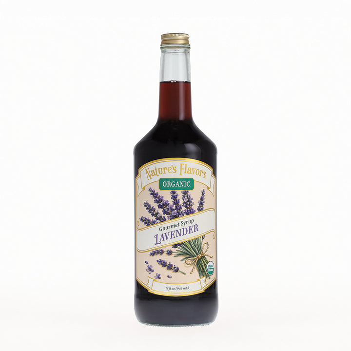 A bottle of Nature's Flavors Organic Gourmet Syrup, Lavender, in a clear glass bottle with a gold cap, set against a plain white background.