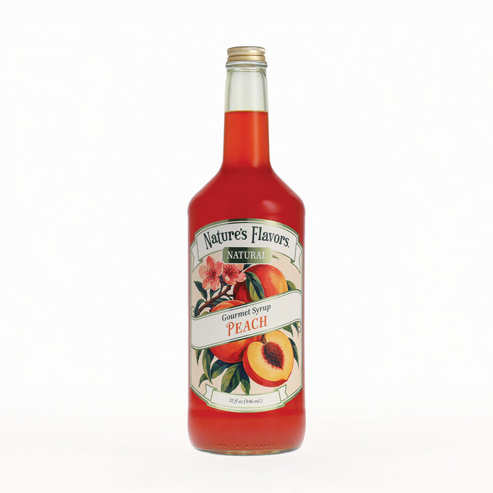 A bottle of Nature's Flavors Gourmet Syrup Peach featuring a detailed peach and floral label, set against a plain white background.