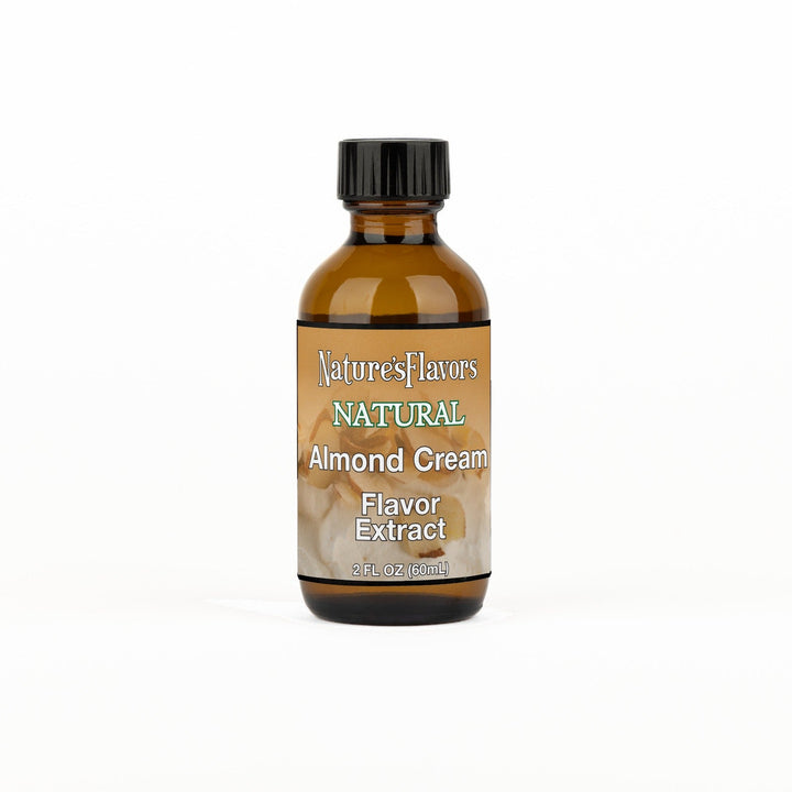 A 2 fl oz amber glass bottle of Nature's Flavors Almond Cream Flavor Extract, Natural with a black cap, centered on a white background.