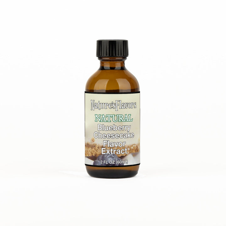 A 2 fl oz amber glass bottle of Nature's Flavors Blueberry Cheesecake Flavor Extract, Natural with a black cap, centered on a white background.