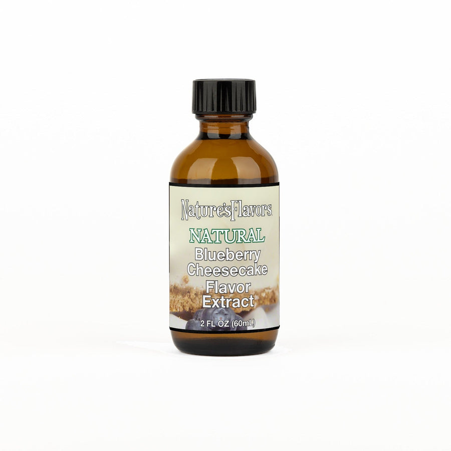 A 2 fl oz amber glass bottle of Nature's Flavors Blueberry Cheesecake Flavor Extract, Natural with a black cap, centered on a white background.