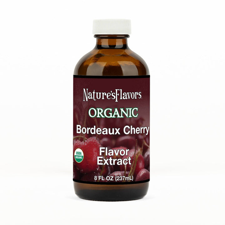 An 8 fl oz amber glass bottle of Nature's Flavors Bordeaux Cherry Flavor Extract, Organic with a white cap, centered on a white background.