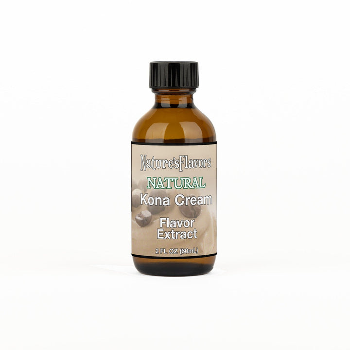 A 2 fl oz amber glass bottle of Nature's Flavors Kona Cream Flavor Extract, Natural with a black cap, centered on a white background.