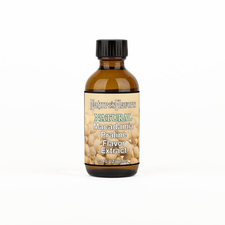 A 2 fl oz amber glass bottle of Nature's Flavors Macadamia Praline Flavor Extract, Natural with a black cap, centered on a white background.