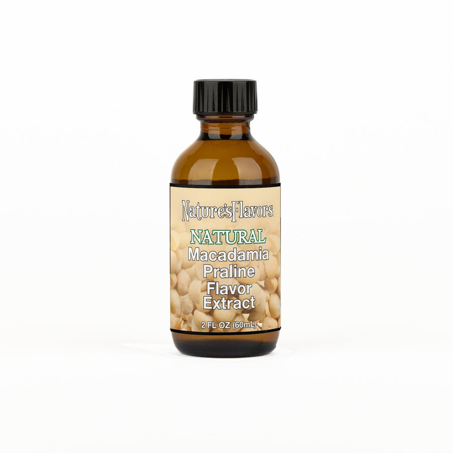 A 2 fl oz amber glass bottle of Nature's Flavors Macadamia Praline Flavor Extract, Natural with a black cap, centered on a white background.