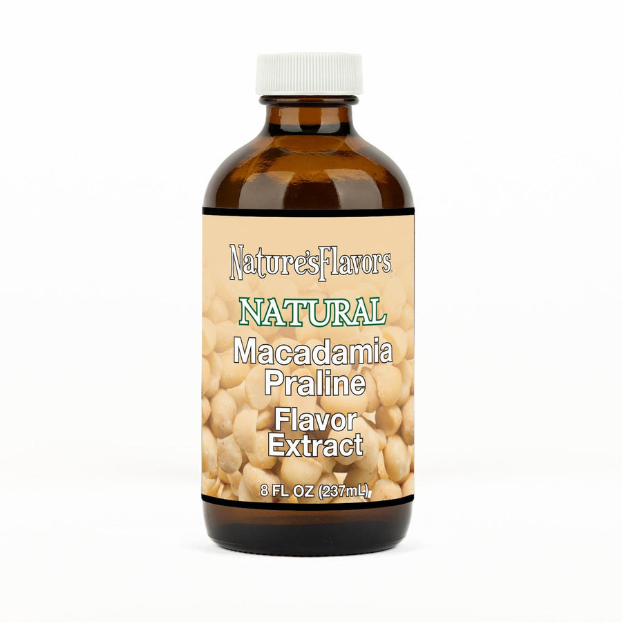 An 8 fl oz amber glass bottle of Nature's Flavors Macadamia Praline Flavor Extract, Natural with a white cap, centered on a white background.