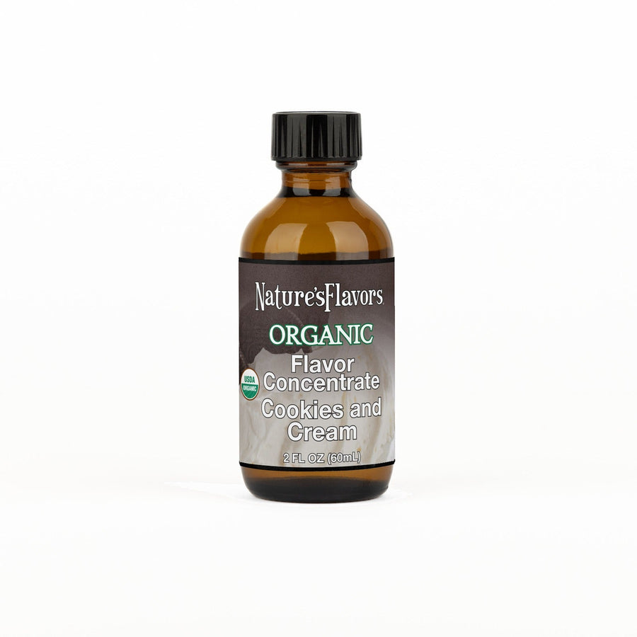 A 2 fl oz amber glass bottle of Nature's Flavors Organic Flavor Concentrate, Cookies and Cream with a black cap, centered on a white background.