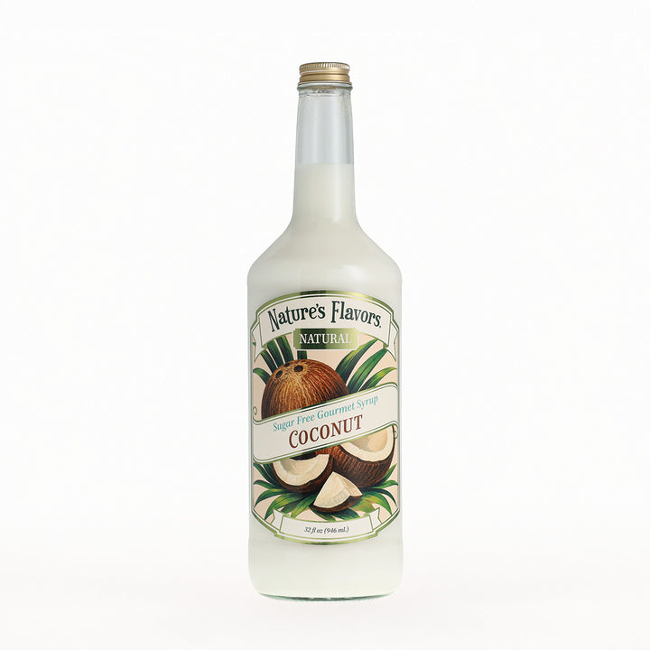 A 32 fl oz glass bottle of Nature's Flavors Natural Coconut Syrup, featuring a white liquid inside, a gold cap, and a detailed label with illustrations of coconuts and green leaves, set against a plain white background.