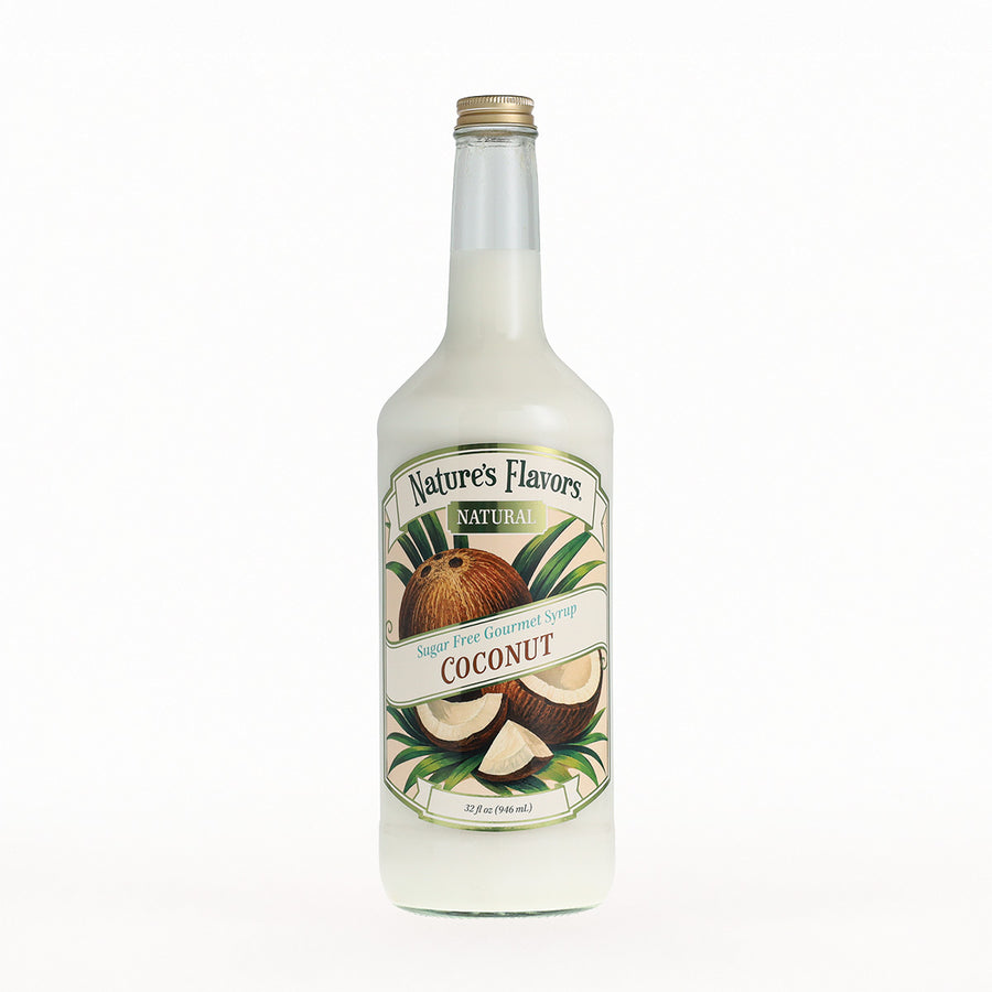 A 32 fl oz glass bottle of Nature's Flavors Natural Coconut Syrup, featuring a white liquid inside, a gold cap, and a detailed label with illustrations of coconuts and green leaves, set against a plain white background.