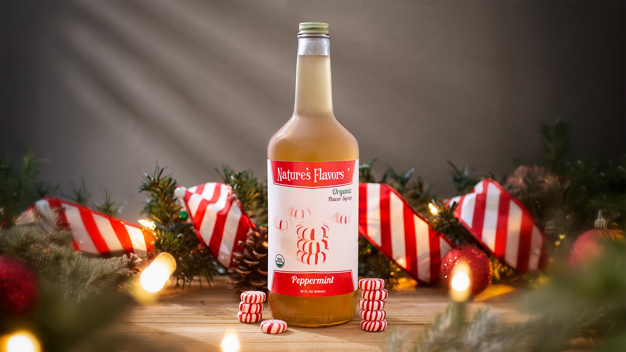 Bottle of Nature's Flavors peppermint flavor syrup with Christmas decorations in the background