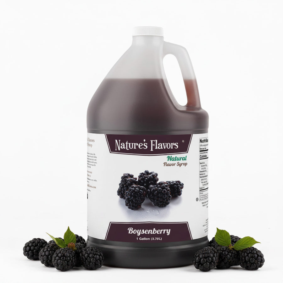 jug labeled, "natural flavor syrup boysenberry" next to boysenberries. 