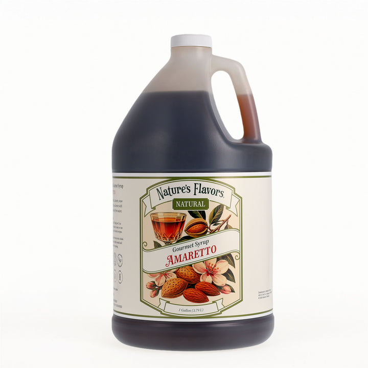 A one-gallon plastic jug of Nature's Flavors Gourmet Syrup in Amaretto, filled with a very dark brown syrup, featuring a cream-colored label with illustrations of almonds and flowers.