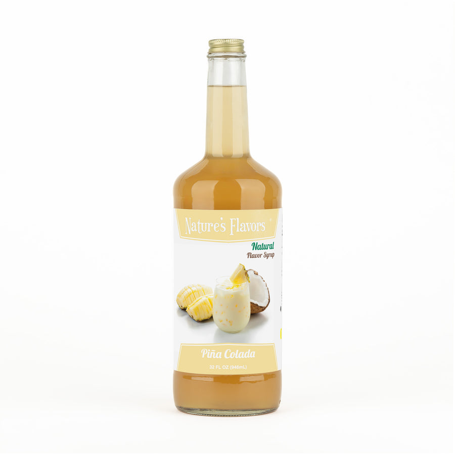A transparent bottle with orange liquid and a label on it that reads, “Natural Flavor Syrup Piña Colada. 32oz.”