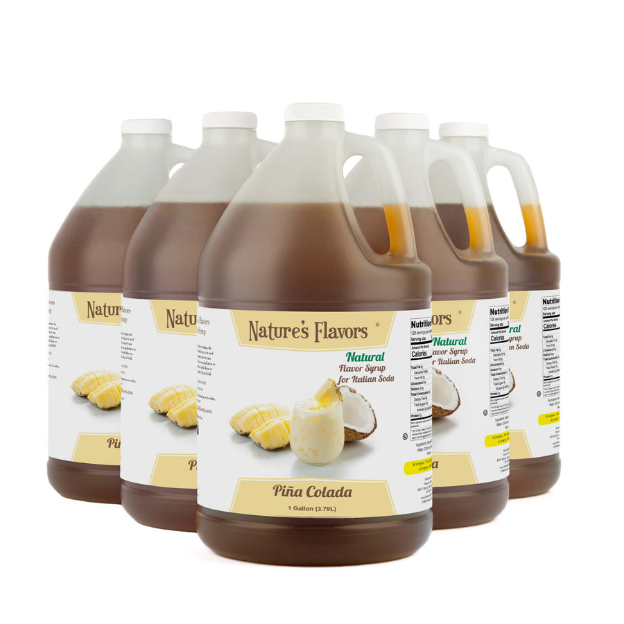 Five 1-gallon bottles with labels that read, "Natural Flavor Syrup for Italian Soda Piña Colada."
