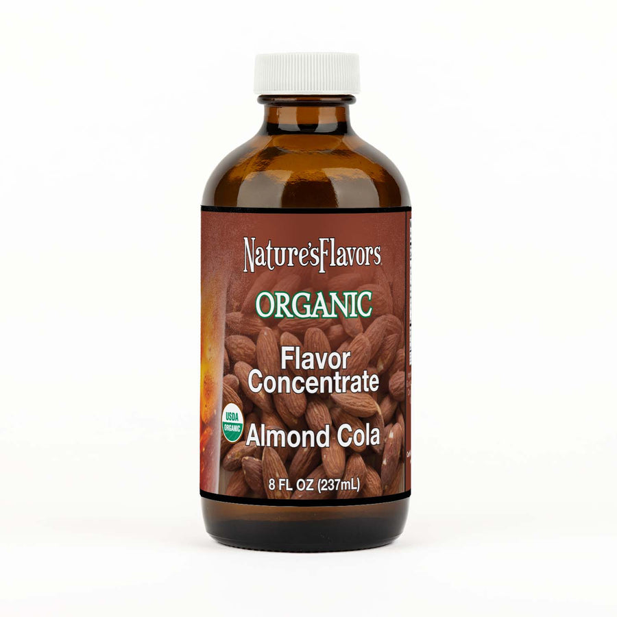 Bottle labeled, "Organic Flavor Concentrate Almond Cola"