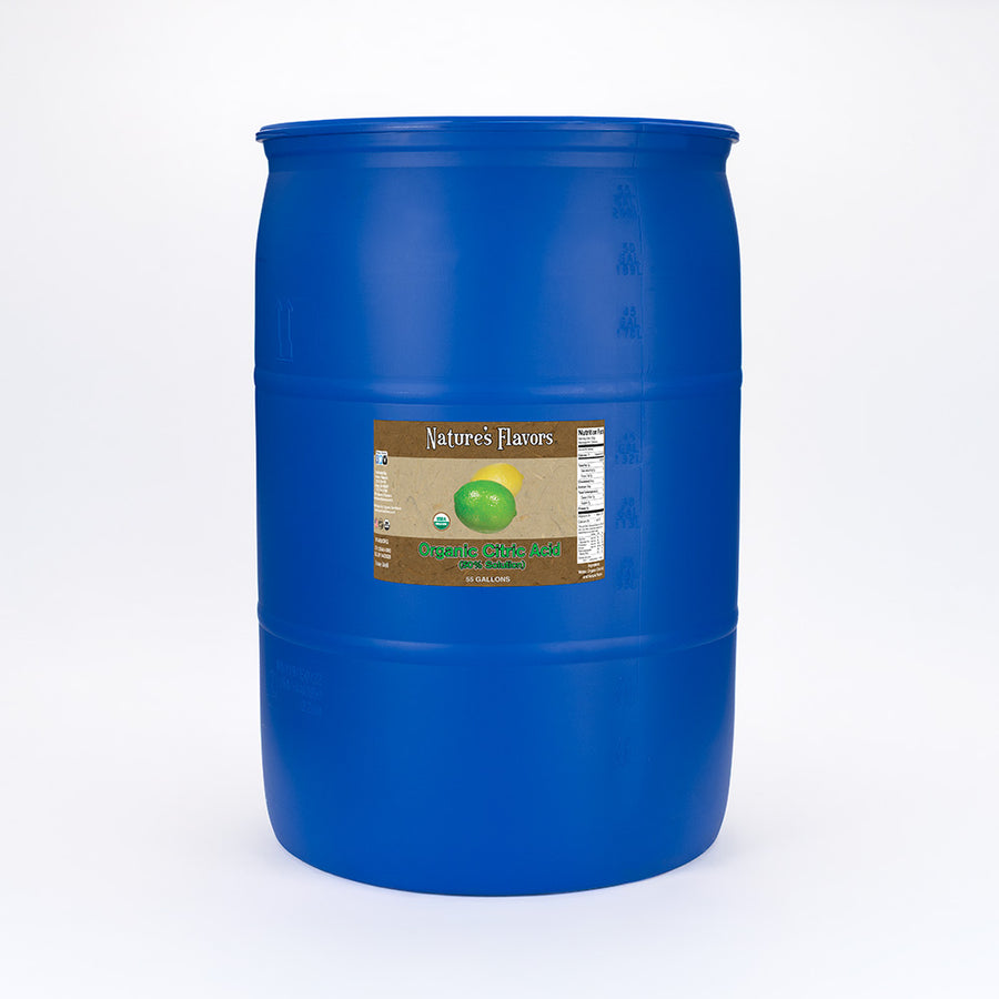 A large blue drum with a label that reads, "Organic Citric Acid (50% Solution). 55 gallon."

