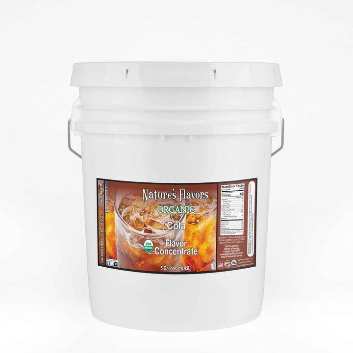 A white bucket with a label on it that reads "Organic Cola Flavor Concentrate. 5 Gallon."
