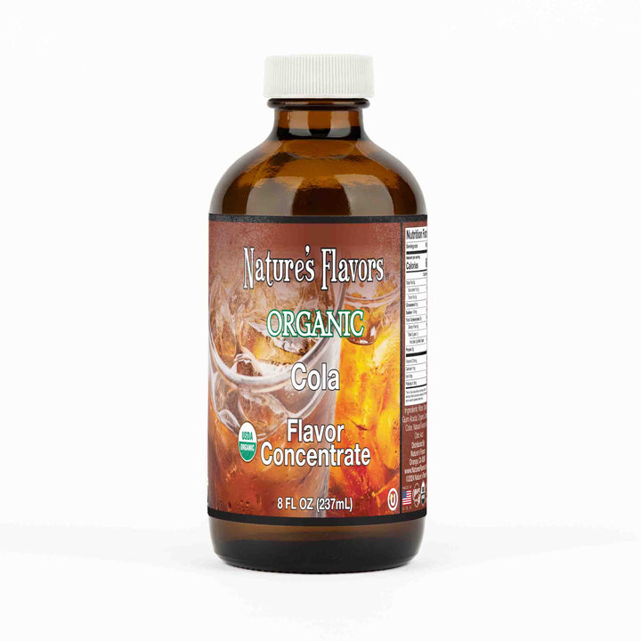 A small brown bottle with a label that reads, "Organic cola flavor concentrate. 8 fl oz."
