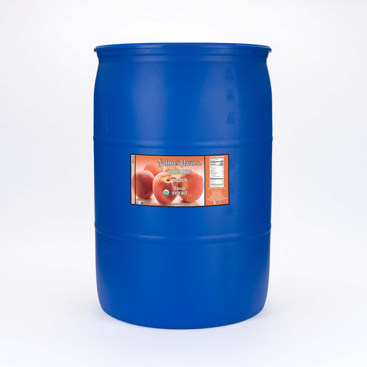 Large blue barrel labeled, "Organic Peach Flavor Extract”.
