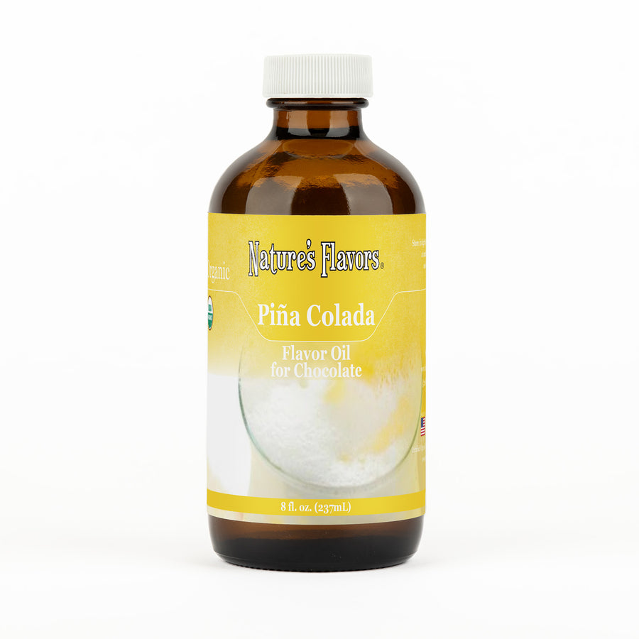 A brown bottle with a label that reads, "Organic Piña Colada Flavor Oil for Chocolate. 8 fl oz."
