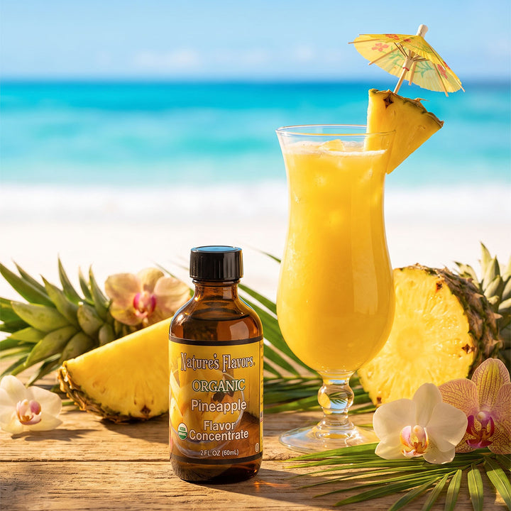 Bottle labeled, "Organic Pineapple Flavor Concentrate" next to a cocktail. 