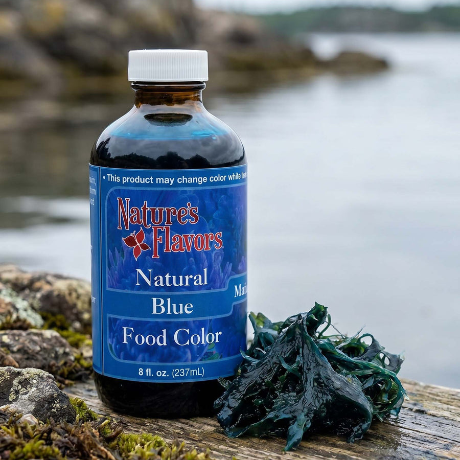 Bottle of Nature's Flavors Natural Blue Food Color on a rock with a natural background