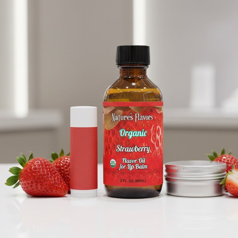 Bottle of Nature's Flavors Organic Strawberry Flavor Oil for Lip Balm with strawberries on a white surface.