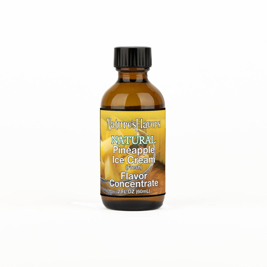 A 2 fl oz amber glass bottle of Nature's Flavors Pineapple Ice Cream Flavor Concentrate (Fresh) with a black cap, centered on a white background.