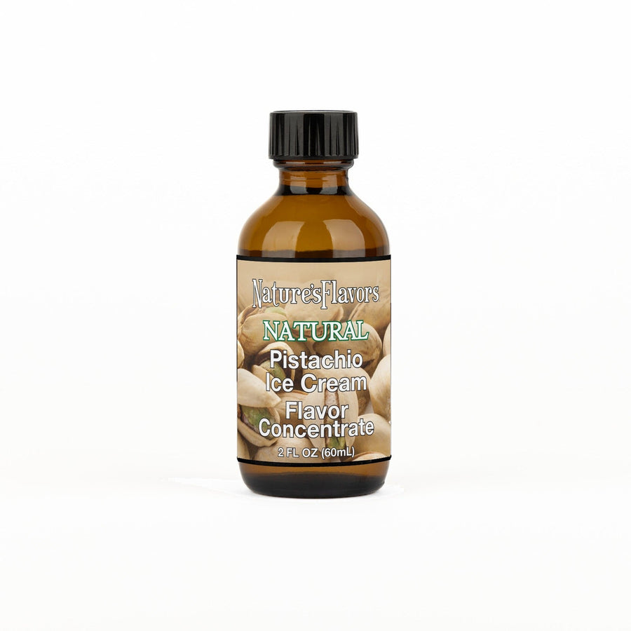 A 2 fl oz amber glass bottle of Nature's Flavors Pistachio Ice Cream Flavor Concentrate with a black cap, centered on a white background.
