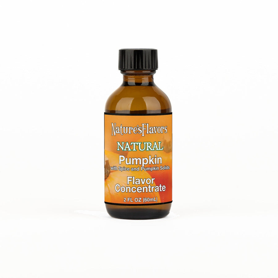 A 2 fl oz amber glass bottle of Nature's Flavors Pumpkin Flavor Concentrate with spice and pumpkin solids, Natural with a black cap, centered on a white background.