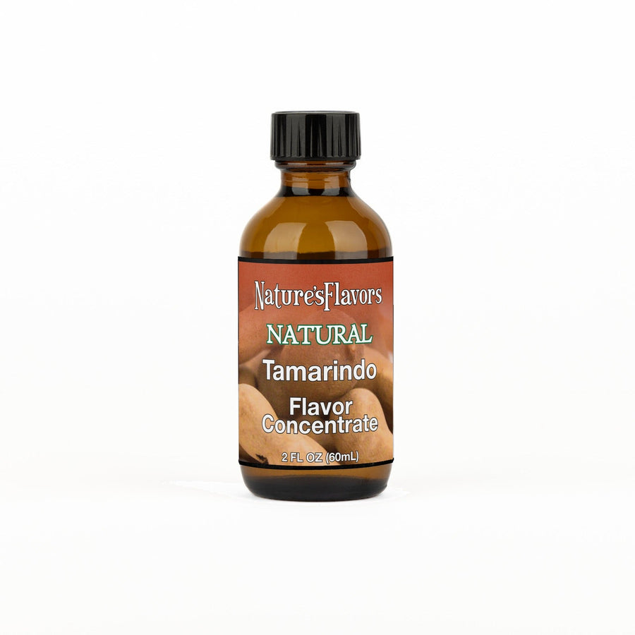 A 2 fl oz amber glass bottle of Nature's Flavors Tamarindo Flavor Concentrate Without Diacetyl with a black cap, centered on a white background.