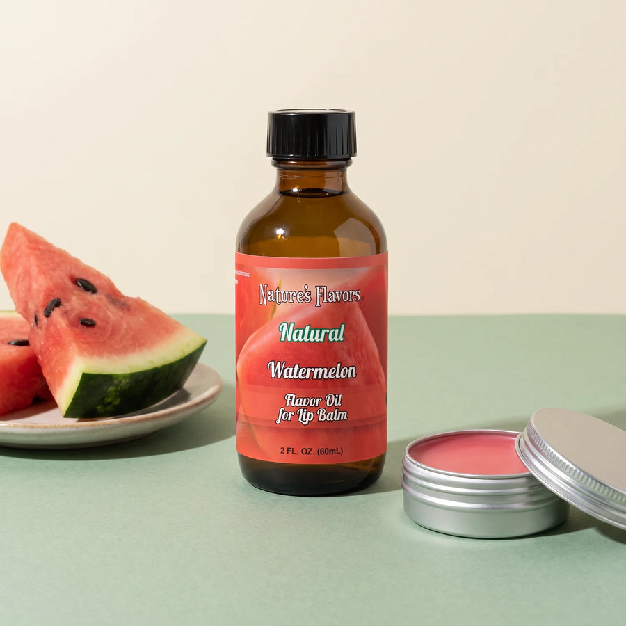 Nature's Flavors Watermelon Flavor Oil for Lip Balm, 2 oz bottle with watermelon and an open unbranded lip balm tin.