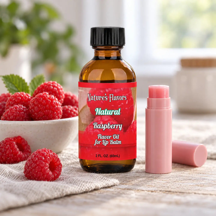 Nature's Flavors Raspberry Flavor Oil for Lip Balm, 2 oz amber bottle with flavor-matched ingredients and an open lip balm.