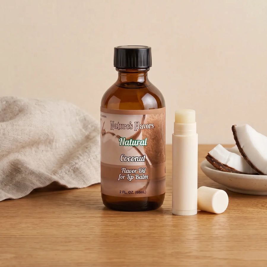 Nature's Flavors Coconut Flavor Oil for Lip Balm, 2 oz bottle with coconut and an open unbranded lip balm tube.