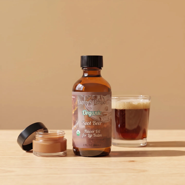 Nature's Flavors Organic Root Beer Flavor Oil for Lip Balm, 2 oz bottle with root beer and an open unbranded lip balm jar.