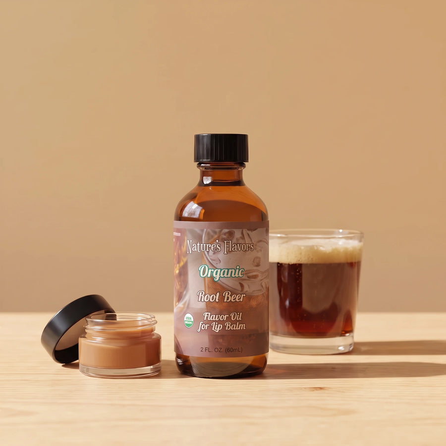 Nature's Flavors Organic Root Beer Flavor Oil for Lip Balm, 2 oz bottle with root beer and an open unbranded lip balm jar.