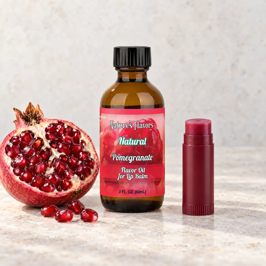 Nature's Flavors Pomegranate Flavor Oil for Lip Balm, 2 oz amber bottle with flavor-matched ingredients and an open lip balm.