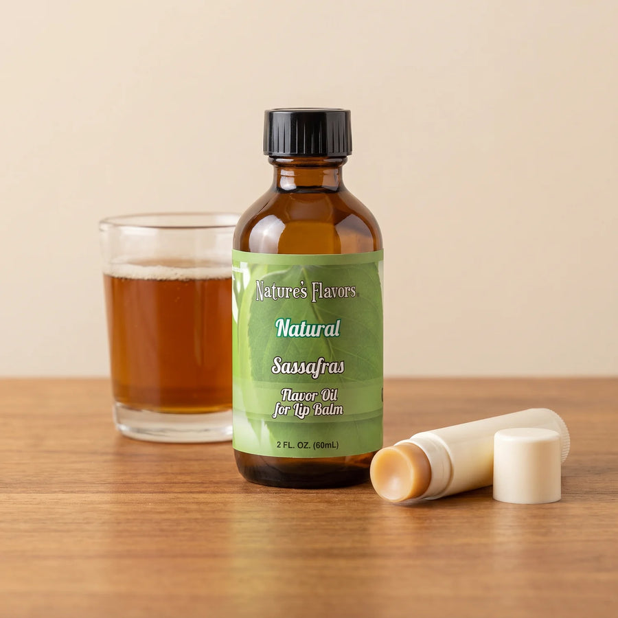 Nature's Flavors Sassafras Flavor Oil for Lip Balm, 2 oz bottle with a soda flavor cue and an open unbranded lip balm tube.