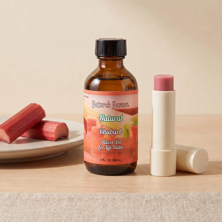 Nature's Flavors Rhubarb Flavor Oil for Lip Balm, 2 oz bottle with rhubarb and an open unbranded lip balm tube.