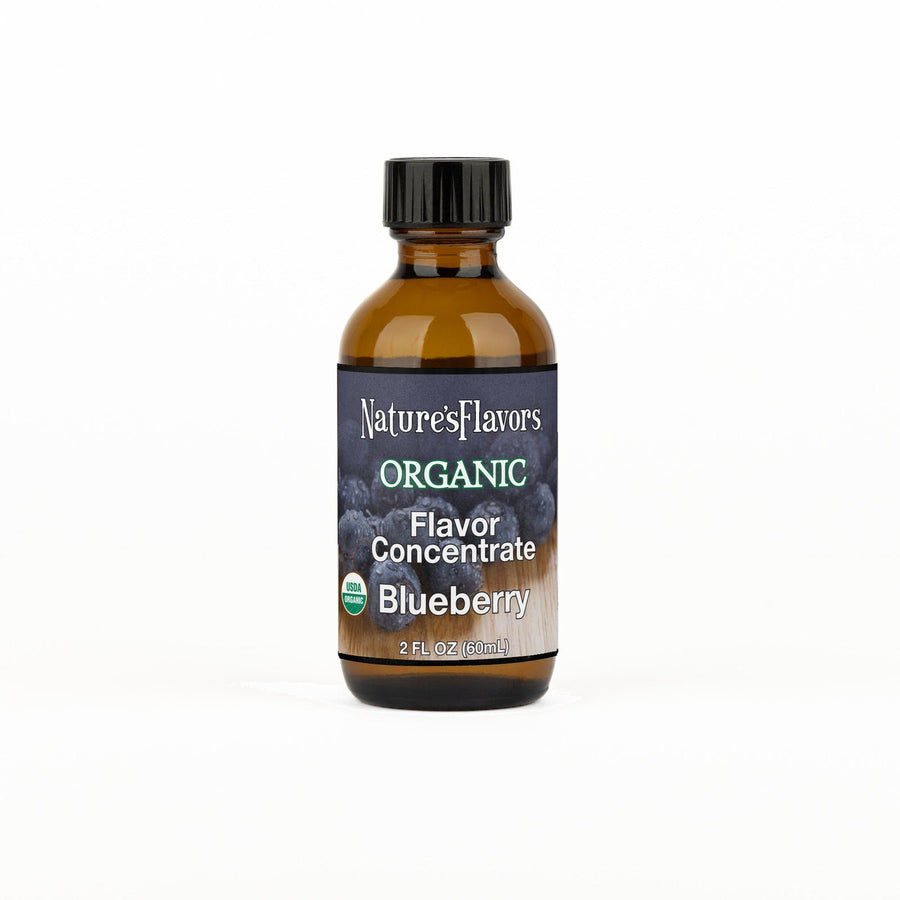 A 2 fl oz amber glass bottle of Nature's Flavors Organic Flavor Concentrate without Diacetyl, Blueberry with a black cap, centered on a white background.